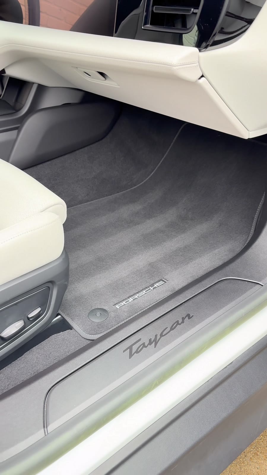 Spotless deep-cleaned floor mat inside a finished Porsche Taycan