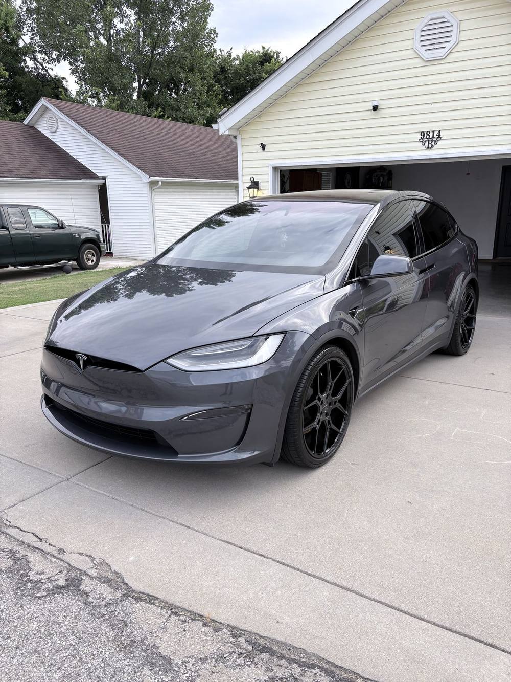 Gray Tesla Model X freshly detailed at a customer's home